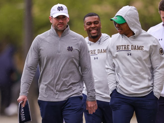 Notre Dame offensive coordinator Gerad Parker, left, and wide receivers coach Chansi Stuckey, right, are expected to be on the recruiting trail together Friday.