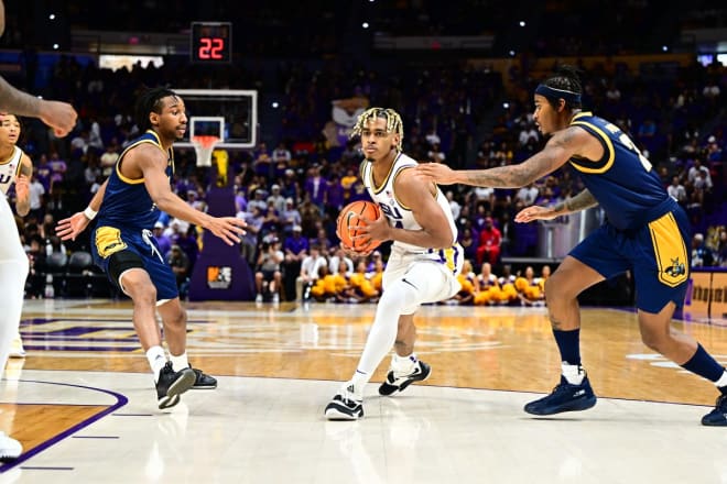 Illinois transfer guard Adam Miller, who missed LSU's 2021-22 season with a knee injury, scored 18 points in his Tigers' debut in Wednesday's season-opening victory over Kansas City.