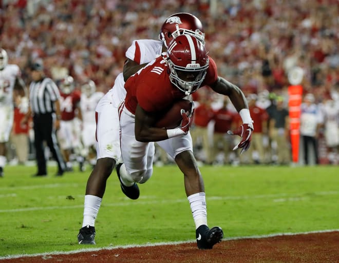 Alabama freshman receiver Henry Ruggs runs in a 20-yard touchdown reception against Arkansas last week. Photo | Getty Images