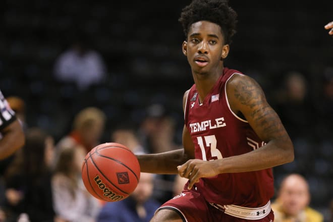 Temple Owls guard Quinton Rose surveys the defense as he looks to attack the basket