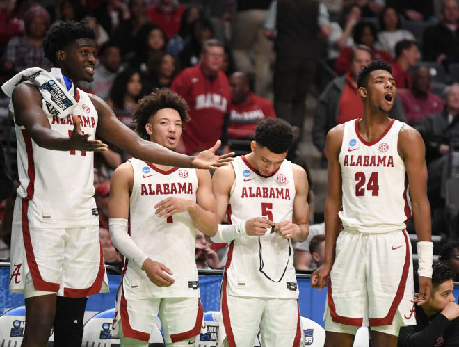 Alabama center Charles Bediako (14), Alabama guard Mark Sears (1), Alabama guard Jahvon Quinerly (5), and Alabama forward Brandon Miller (24) watch from the bench as the games comes to a close at Legacy Arena. Alabama advanced to the second round of the NCAA Tournament with a 96-75 win over Texas A&M Corpus Christi. Photo | Gary Cosby Jr.-Tuscaloosa News