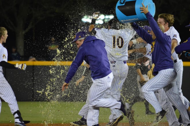 Brady Lloyd is doused after his game winning bunt got (7)ECU past Campbell 4-3 Tuesday night in Greenville.