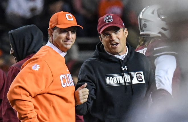 Dabo Swinney chats with Shane Beamer before their rivalry game. 