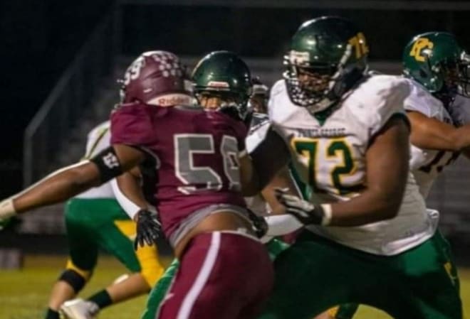 Prince George offensive tackle Jaelin Montgomery (72), a James Madison commit, blocks during a game last season.