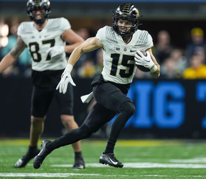 Purdue Boilermakers wide receiver Charlie Jones (15) rushes the ball during the Big Ten football championship on Saturday, Dec. 3, 2022 at Lucas Oil Stadium in Indianapolis. Michigan Wolverines lead at the half against the Purdue Boilermakers, 14-13. Ncaa Football Big Ten Championship Football Game Purdue Boilermakers At Michigan Wolverines