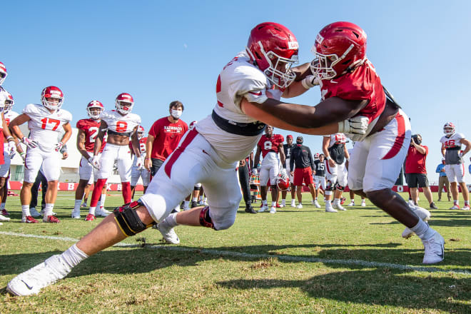 Brady Latham and Taurean Carter square off on the first day of full pads in fall camp.