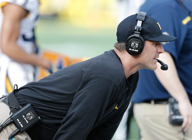 Michigan Wolverines football coach Jim Harbaugh and is team are struggling in year six.