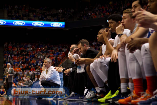 The Boise state bench reacts to the play on the court.