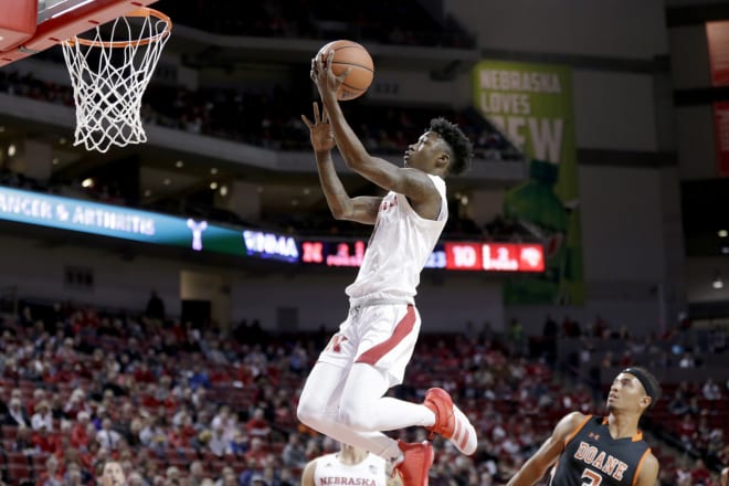 Nebraska Cornhuskers guard Cam Mack attempts a layup in front of a Doane University player at Pinnacle Bank Arena.