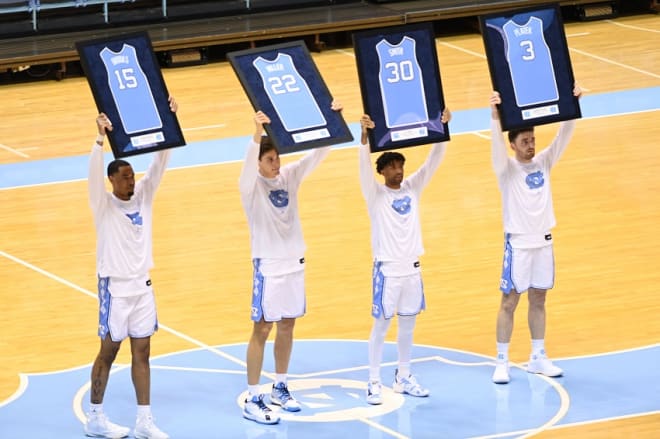 Miller (22) and the other three seniors were honored before the game.