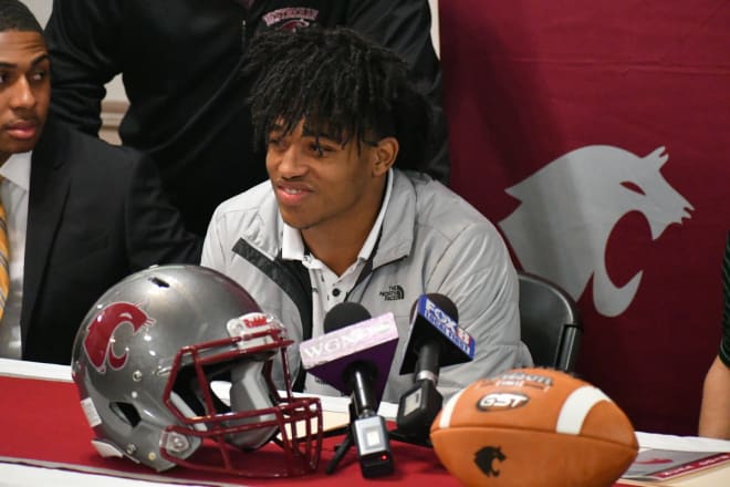 John Emery Jr. sits at the front of Destrehan's banquet room on Signing Day on Dec. 19, 2018