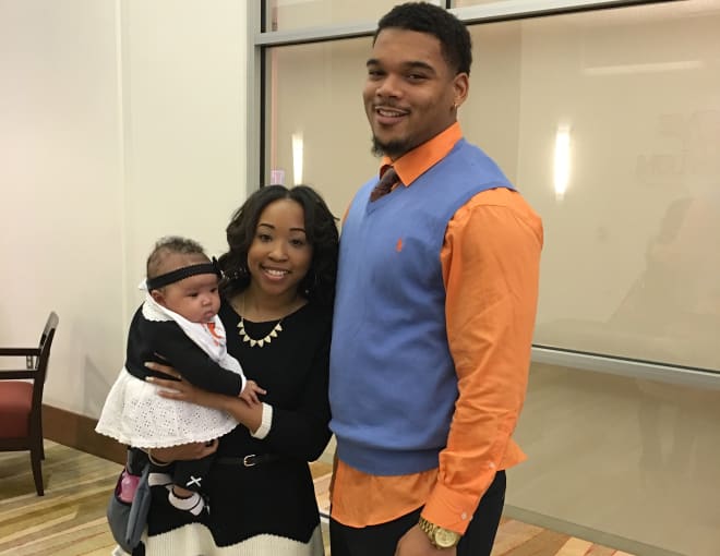 T.J. Neal and girlfriend Chanel Blackwell, who is holding their 5-month-old daughter, Ty.