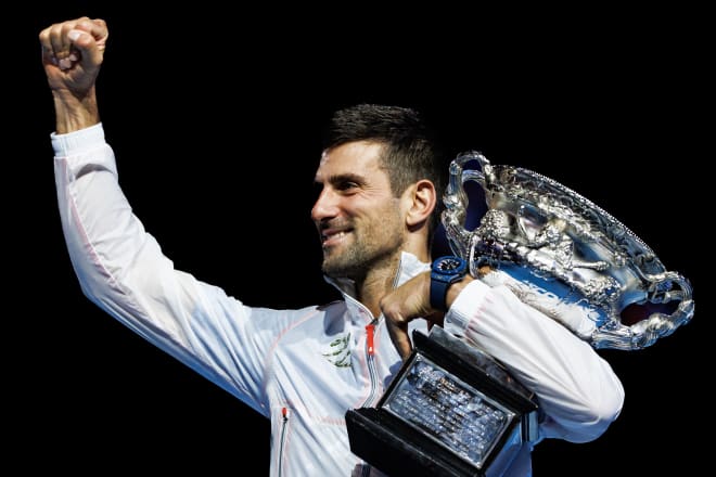 Novak Djokovic of Serbia celebrates with the trophy after his victory over Stefanos Tsitsipas of Greece in the men's final on day fourteen of the 2023 Australian Open tennis tournament at Melbourne Park. Mandatory Credit: Mike Frey-USA TODAY Sports