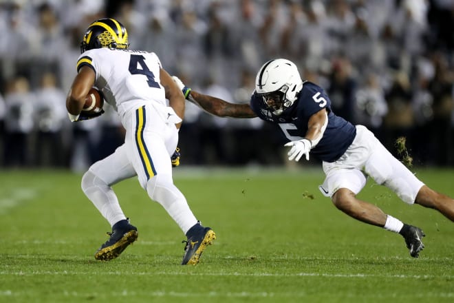 Michigan Wolverines junior wide receiver Nico Collins dodging a defender in Michigan's 28-21 loss to Penn State last week.