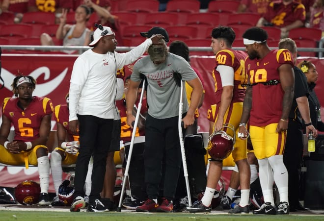 USC sophomore quarterback JT Daniels on crutches on the sideline in the second half of the Trojans' season-opening 31-23 win over Fresno State.