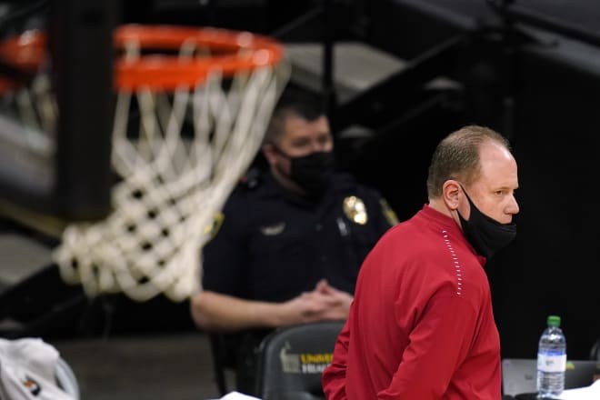 Greg Gard watches the first half of Wisconsin's regular-season finale at Iowa