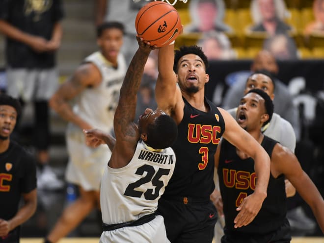 Senior point guard McKinley Wright IV attempts a layup over USC's Isaiah Mobley