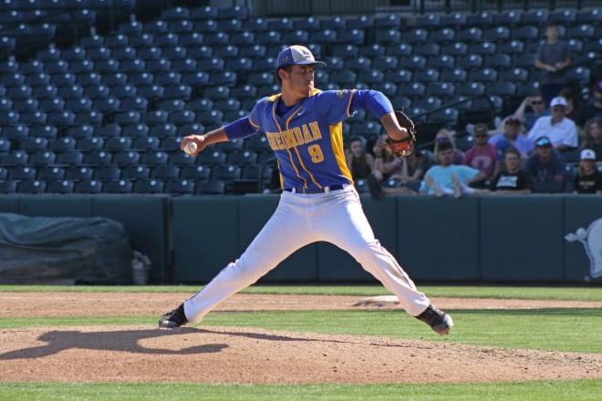 Tyler Cacciatori pitches in the 2019 Class 5A state championship game at Baum-Walker Stadium.