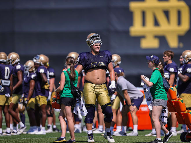 Notre Dame left tackle Joe Alt, center, was named to the AP preseason All-America first team.
