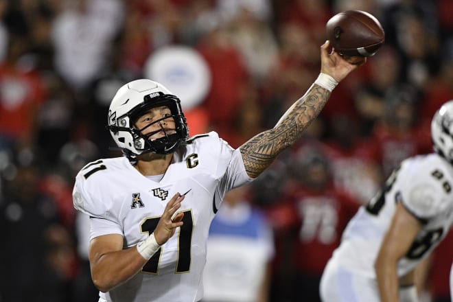 UCF Knights quarterback Dillon Gabriel (11) throws a pass against the Louisville Cardinals during the second half at Cardinal Stadium. Louisville defeated Central Florida 42-35. Jamie Rhodes-USA TODAY Sports