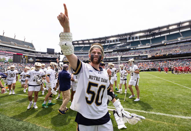 Chris Kavanagh (50) celebrates top seed Notre Dame's 13-6 victory over Denver, Saturday in an NCAA Men's Lacrosse semifinal game in Philadelphia.