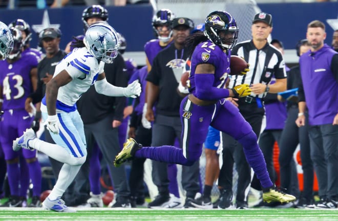 Sep 22, 2024; Arlington, Texas, USA; Baltimore Ravens running back Derrick Henry (22) runs with the ball as Dallas Cowboys cornerback Trevon Diggs (7) chases during the second half at AT&T Stadium. | Photo: Kevin Jairaj-Imagn Images