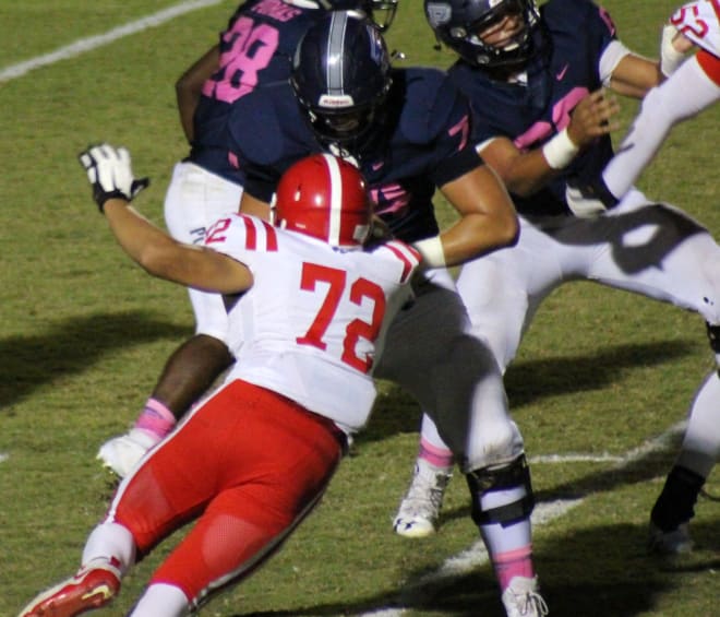 Perry offensive tackle Brayden Rohme applies a block in a home game against Brophy from last October.  Rohme, who was a First Team All-State offensive tackle for the 6A Conference, signed with California.