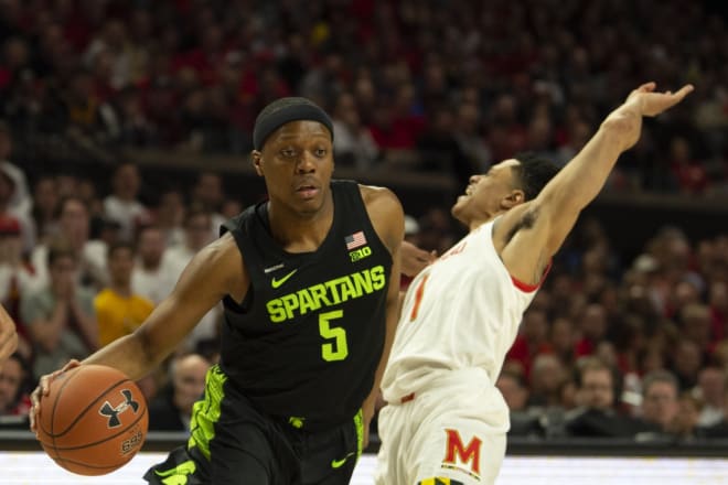 Michigan State point guard Cassuis Winston (No. 5) drives past Maryland point guard Anthony Cowan (No. 1) in the Spartans' win over the Terps. 