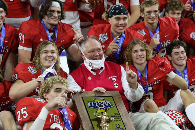Jackson (black bandana) and his Center Grove teammates celebrate their 2020 IHSAA 6A state title victory with Moore.