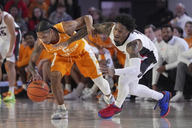 Tennessee guard Zakai Zeigler (5) steals the ball from Georgia guard Justin Hill (11) during the half half of an NCAA college basketball game Saturday, Jan. 13, 2024, in Athens, Ga. (AP Photo/John Bazemore)
