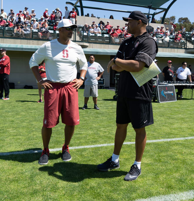 Defensive line coach Diron Reynolds, left, and David Shaw are in a tough spot to upgrade the defensive line pipeline.