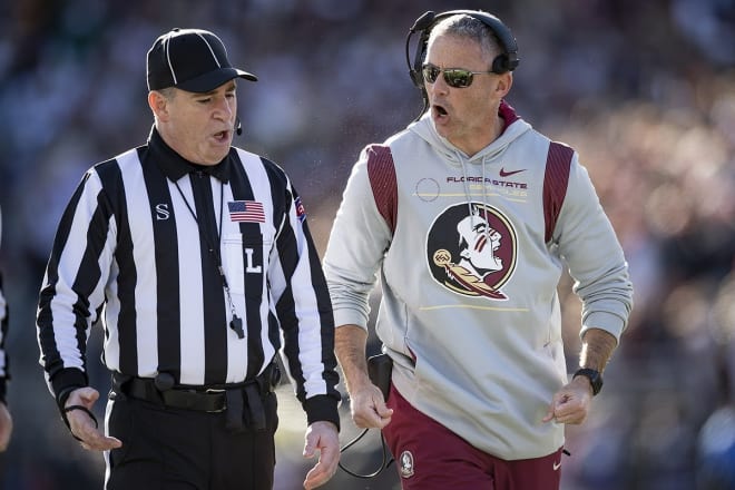 FSU football coach Mike Norvell shares a few choice words with a referee.