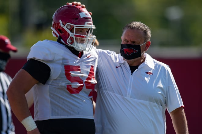 Head coach Sam Pittman talks with walk-on offensive lineman Austin Nix.