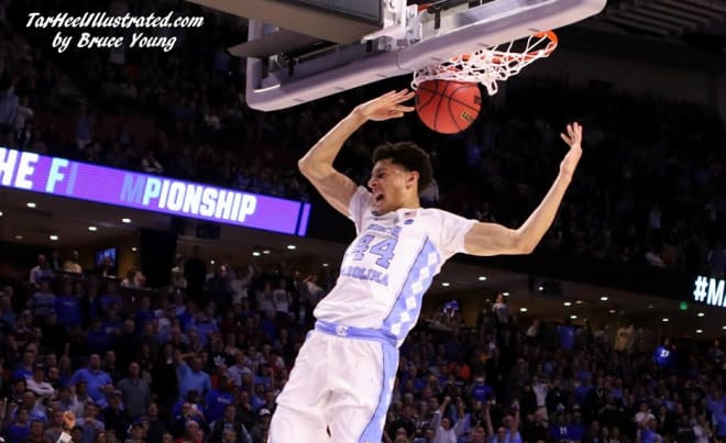The Tar Heels close on a 12-0 run to escape Arkansas and advance to the Sweet 16 on Sunday night. 