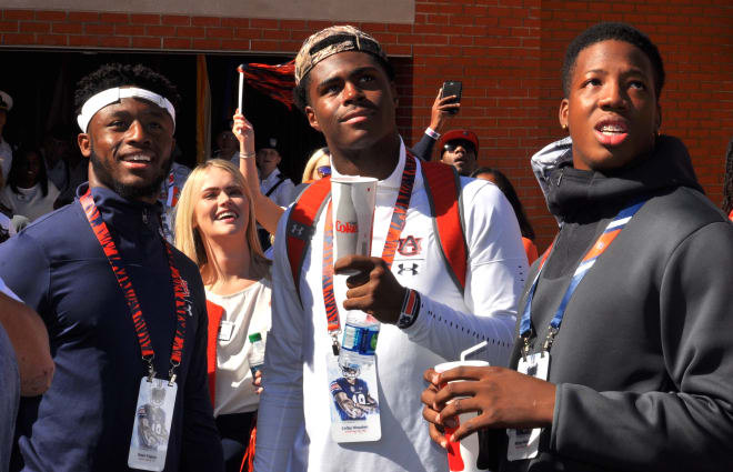 Owen Pappoe, Colby Wooden and Wanya Morris Saturday at Auburn.