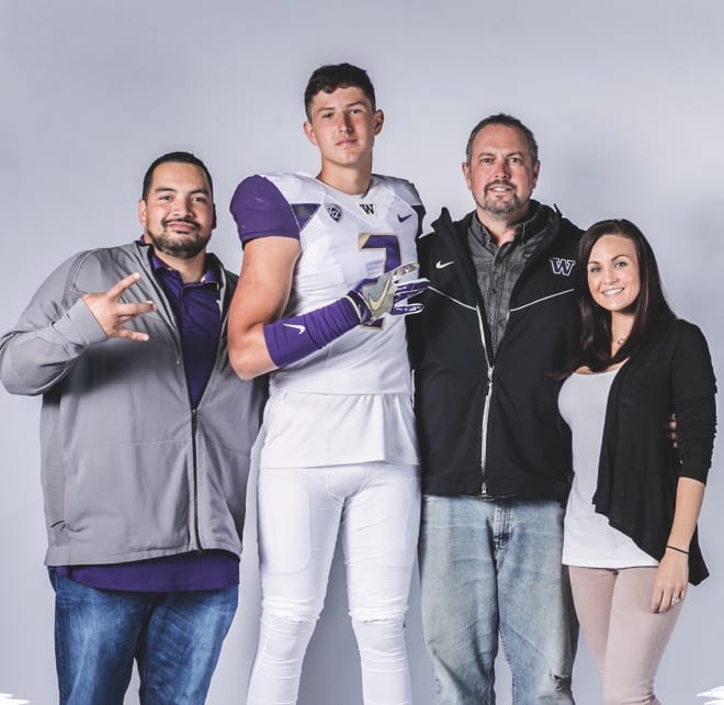 UW tight ends coach Jordan Paopao (left), four-star TE Kole Taylor (center, left) with his parents (right) during on an official visit to Washington. 