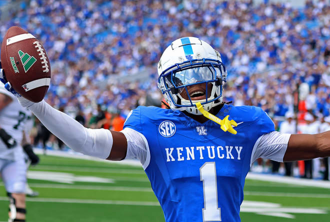 Kentucky cornerback Maxwell Hairston celebrated his interception return for a touchdown in the second half of the Wildcats' 41-6 win over Ohio on Saturday at Kroger Field. 