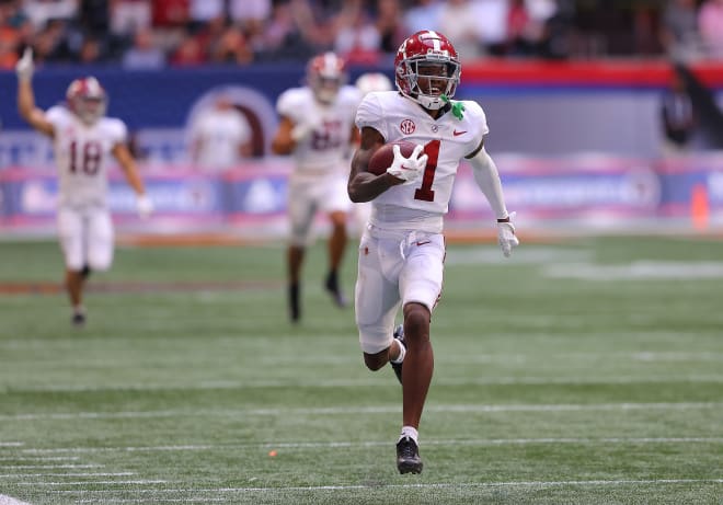 Alabama Crimson Tide receiver Jameson Williams runs in a 94-yard touchdown against Miami. Photo | Getty Images