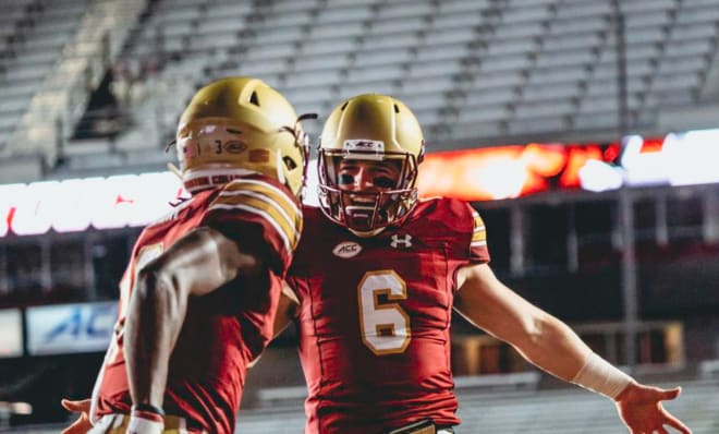 Boston College quarterback Dennis Grosel (6) recovers a fumble as