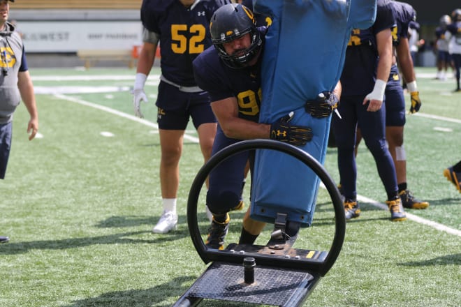 Schrider (98) is back in his hometown, has earned a scholarship, and is set to be a rotation piece for the Cal defense 
