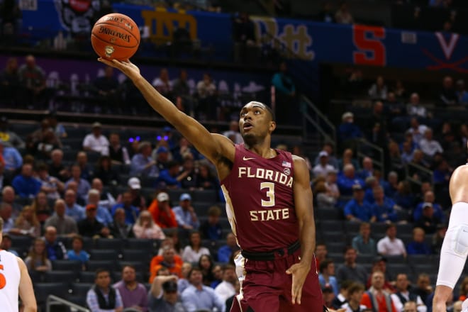 Trent Forrest attempts a finger roll in the second half of the Seminoles' upset win of Virginia on Friday night.