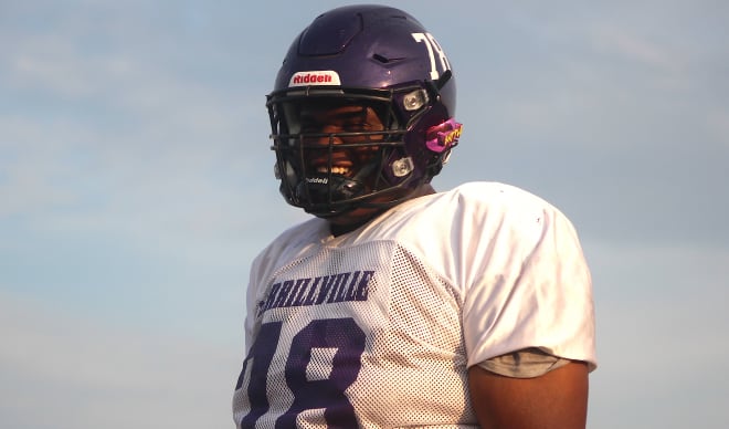 Indiana defensive tackle Kenneth Grant holds a Michigan Wolverines football recruiting offer from Jim Harbaugh.