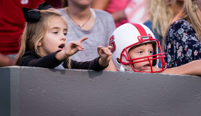 Two young fans are enjoying the action.
