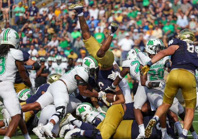 Notre Dame running back Logan Diggs is upended just short of the goal line during ND's 26-21 loss to Marshall, Saturday at Notre Dame Stadium.