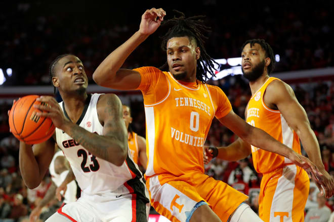 Tennessee forward Jonas Aidoo (0) defended Georgia forward Jalen DeLoach (23) during a NCAA college basketball game between Tennessee and Georgia in Athens, Ga., on Saturday, Jan. 13, 2024.