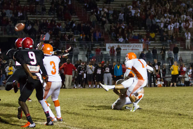 Austin Jones kicks the game-winning field goal for Boone High School in a game against Edgewater in 2012. Photo | David Evertsen / Conway News 