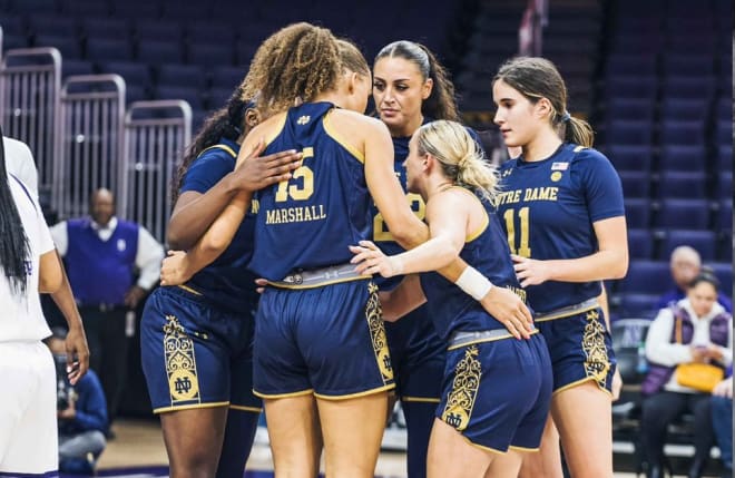 The Irish huddle during their 92-58 victory at Northwestern on Wednesday night.