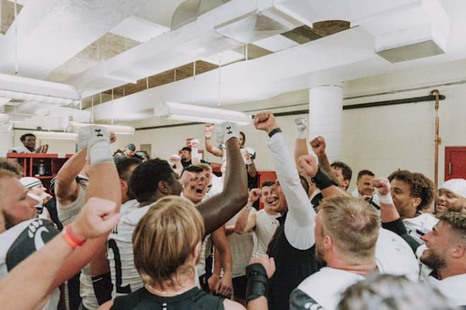 Cincinnati head coach Luke Fickell leads a round of celebration after the Bearcats rallied to beat the Hoosiers.