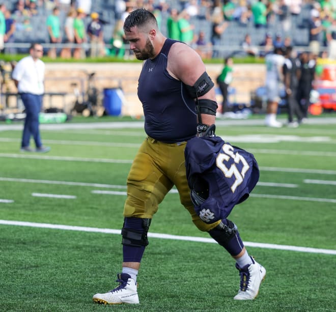 A frustrated Notre Dame offensive guard Jarrett Patterson leaves to field after a 26-21 Irish loss to Marshall on Saturday.