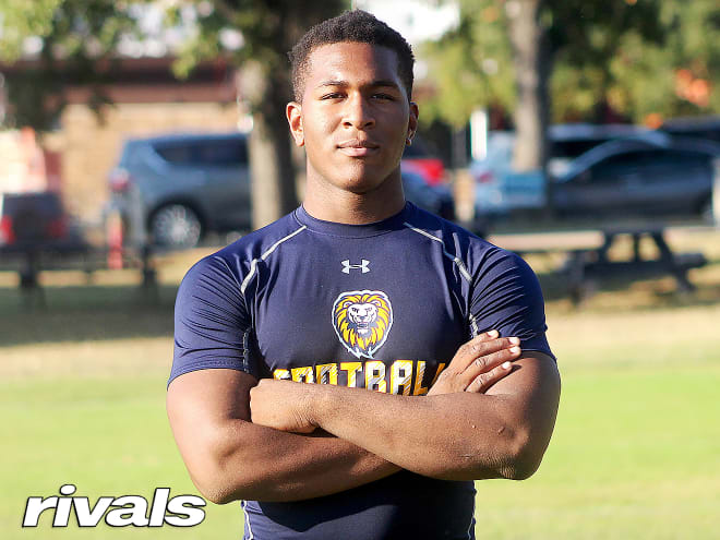 Texas defensive lineman Jadon Scarlett holds a Michigan Wolverines football recruiting offer from Jim Harbaugh.